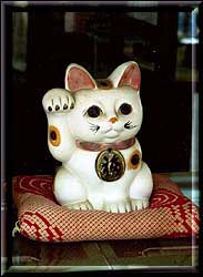 The Maneki Neko, literally 'Beckoning Cat'; also known as 'Welcoming Cats'